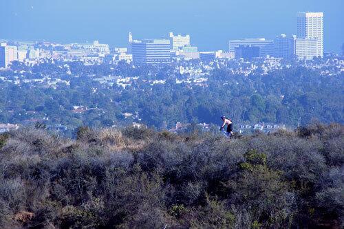 A mountain biker rides the Inspiration Loop Trail in Will Rogers State Historical Park.