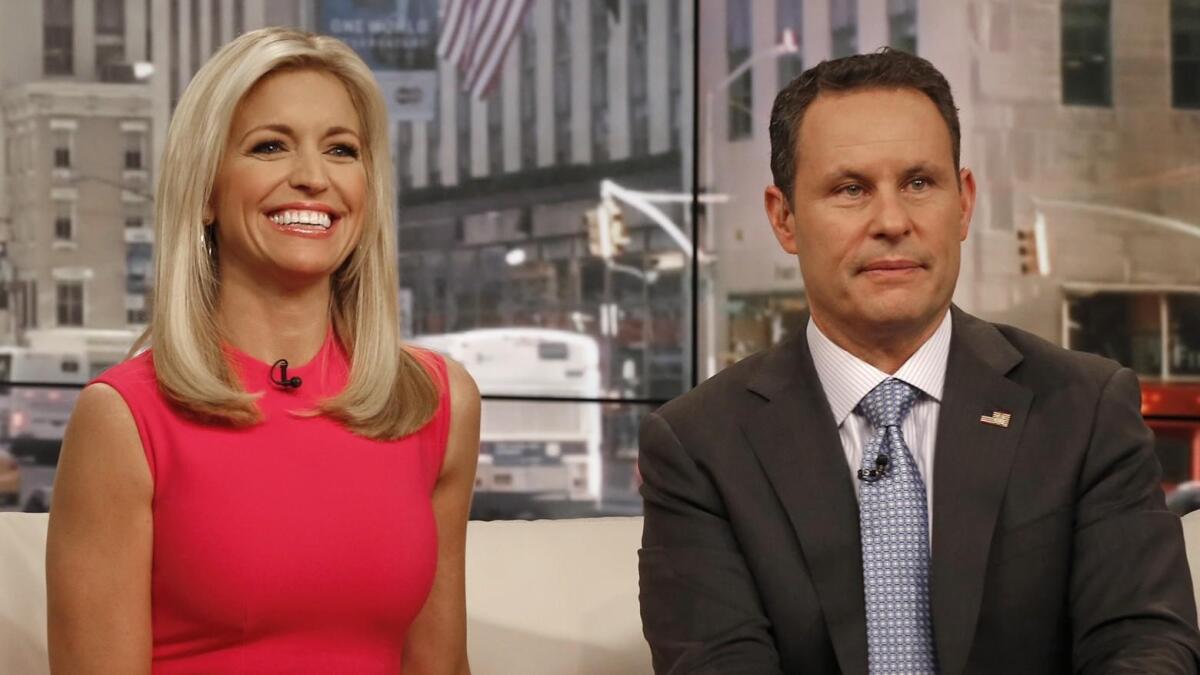 Ainsley Earhardt, left, and Brian Kilmeade appear on the set of Fox News on March 3, 2017.