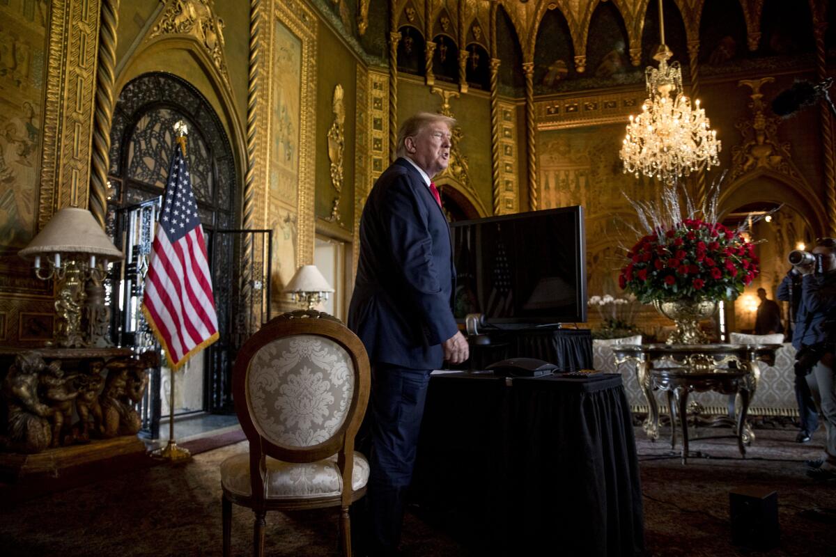 FILE - In this Dec. 24, 2019, file photo President Donald Trump speaks to members of the media following a Christmas Eve video teleconference with members of the military at his Mar-a-Lago estate in Palm Beach, Fla. Congressional Republicans are at a crossroads with Donald Trump. One branch of the party is keeping close to the former president, hoping to harness the power of his political brand for their campaigns. The other is splitting away and trying to chart a post-Trump future. (AP Photo/Andrew Harnik, File)