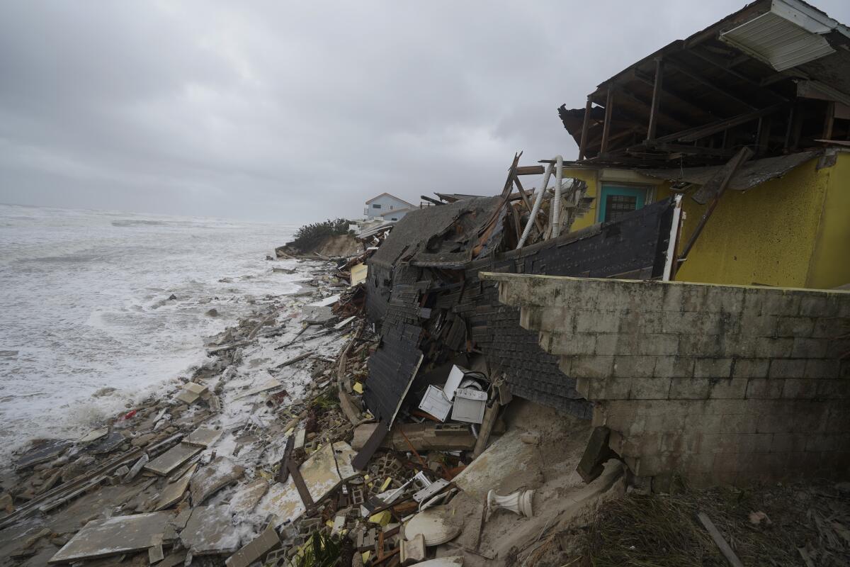 Parts of homes collapsing on beach