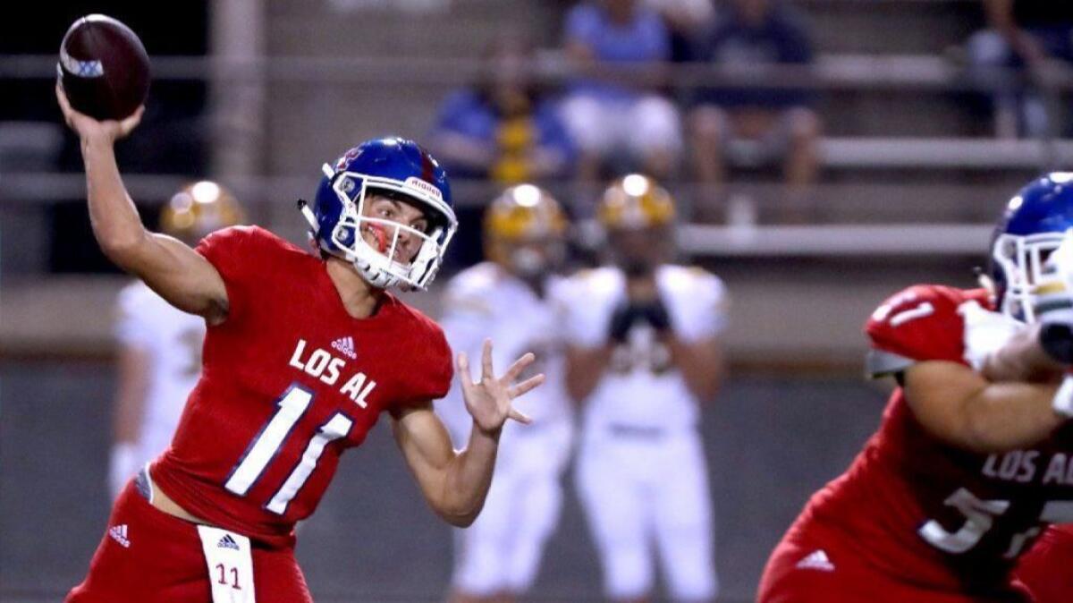 Los Alamitos High quarterback Cade McConnell throws the ball in a Sunset League game against Edison at Cerritos College on Oct. 26. McConnell has helped the Griffins put up 34.5 points per game this season.