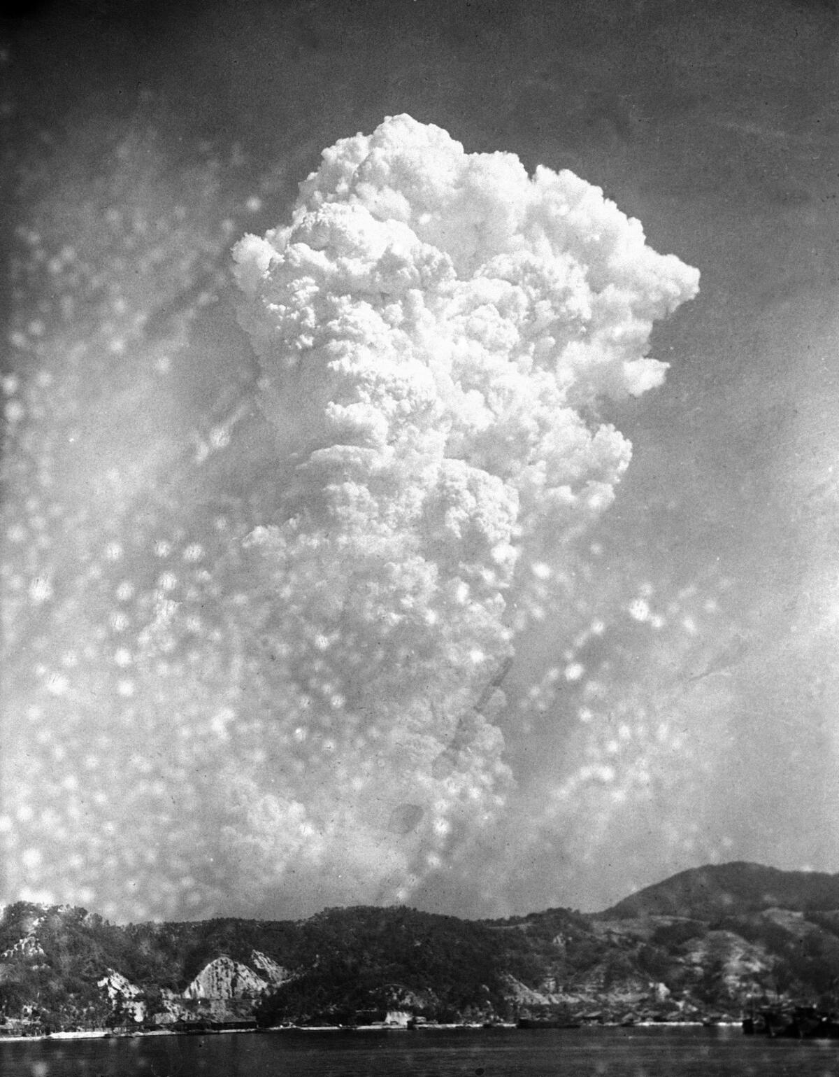 Smoke rises from the bombing of Hiroshima