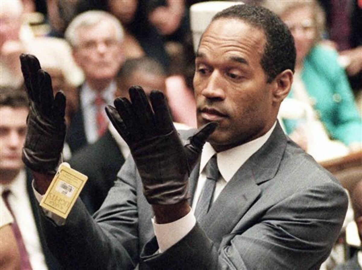 The pivotal moment in the 1995 O.J. Simpson murder trial was when the defendant put on a pair of gloves similar to the bloody ones found at the crime scene.