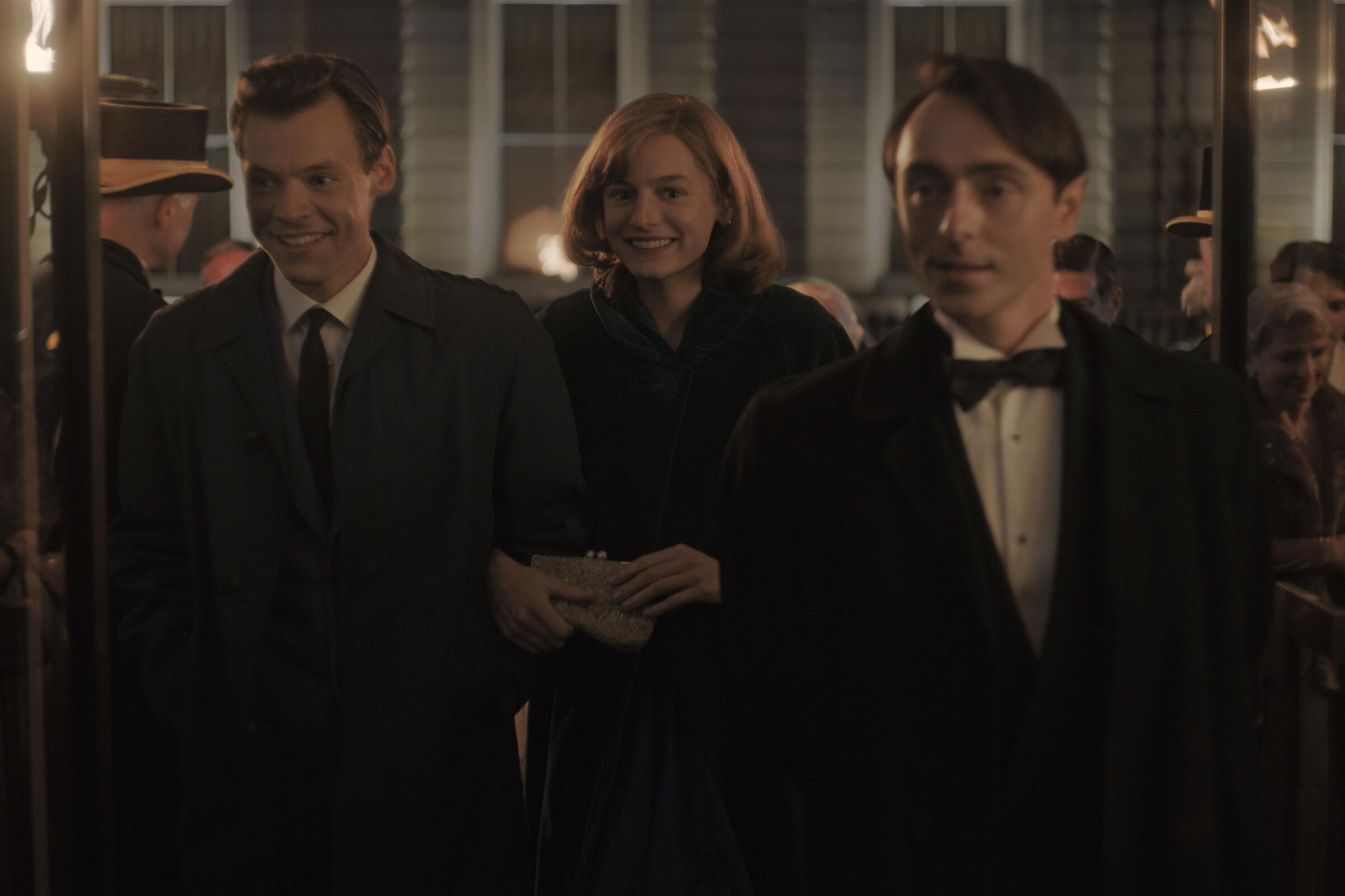 Harry Styles, Emma Corrin and David Dawson in a scene from the movie "My Policeman."