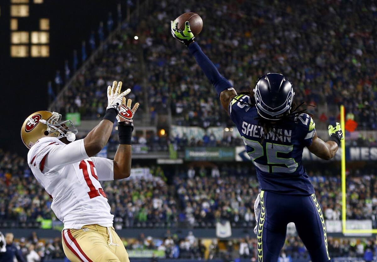 Seahawks cornerback Richard Sherman tips a pass in the end zone intended for 49ers receiver Michael Crabtree in the final minute of the NFC championship game.