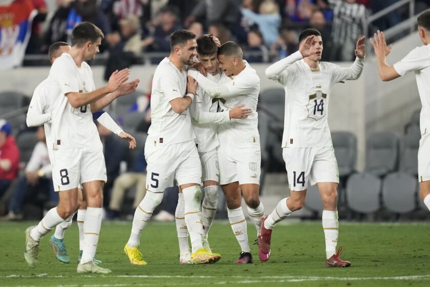 Serbia midfielder Luka Ilić, center, celebrates with his team after scoring during the first half of an international friendly soccer match against the United States in Los Angeles, Wednesday, Jan. 25, 2023. (AP Photo/Ashley Landis)