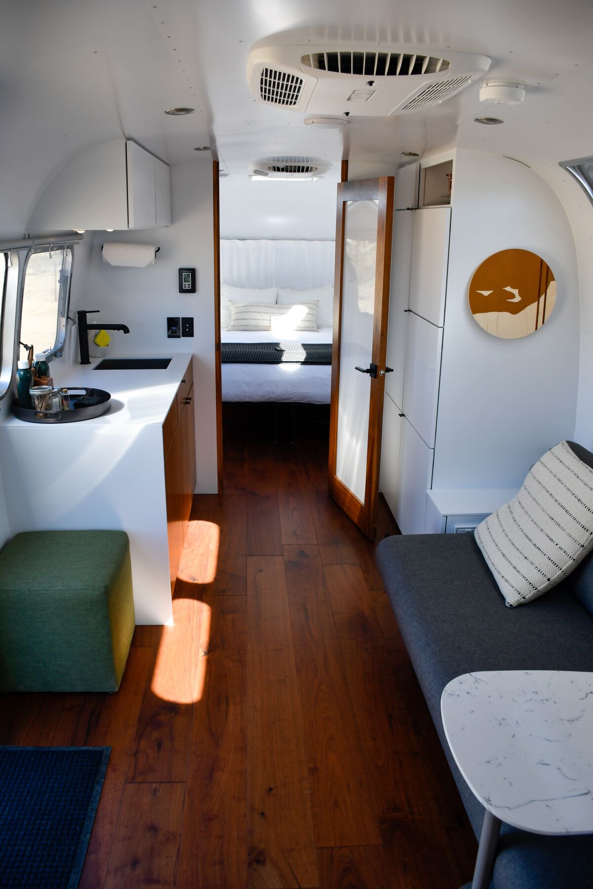 The interior of a furnished Airstream trailer.