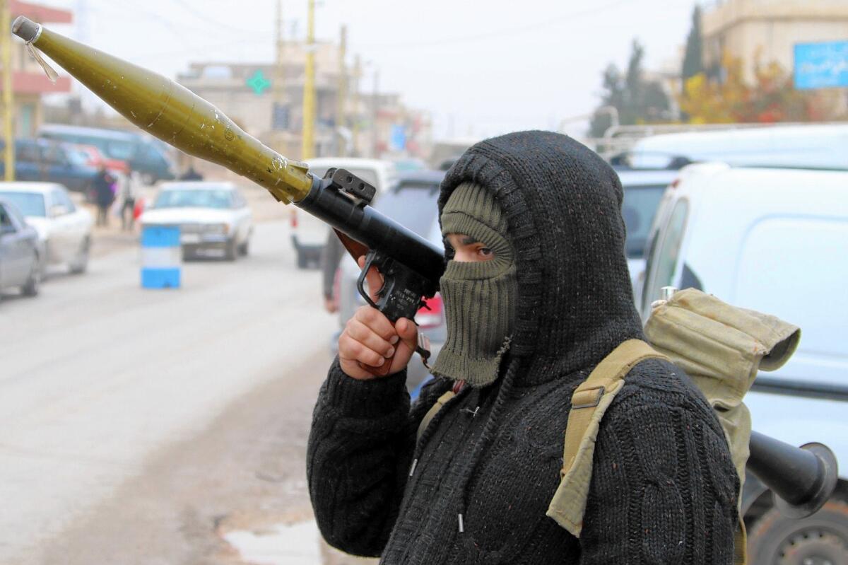 A Shiite Muslim fighter takes part in a roadblock on a route leading to the town of Arsal, in Lebanon's Bekaa Valley.
