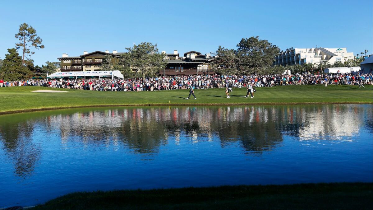 Fans look on at the 18th hole during the Farmers Insurance Open at the Torrey Pines Golf Course on Sunday.