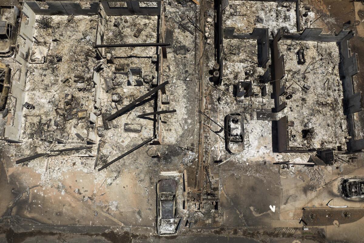  An aerial view of the scorched remains of structures 