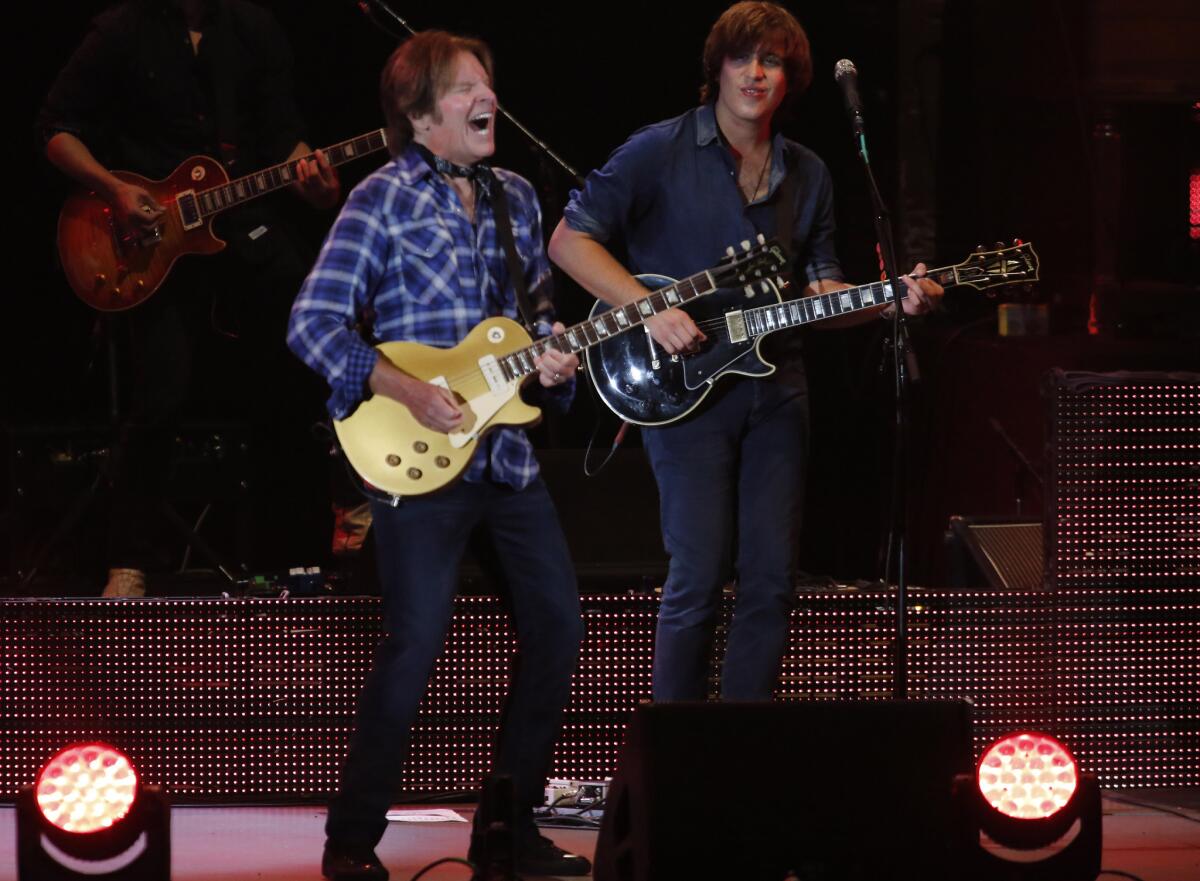 John Fogerty is joined onstage at the Hollywood Bowl by his son Shane, right.