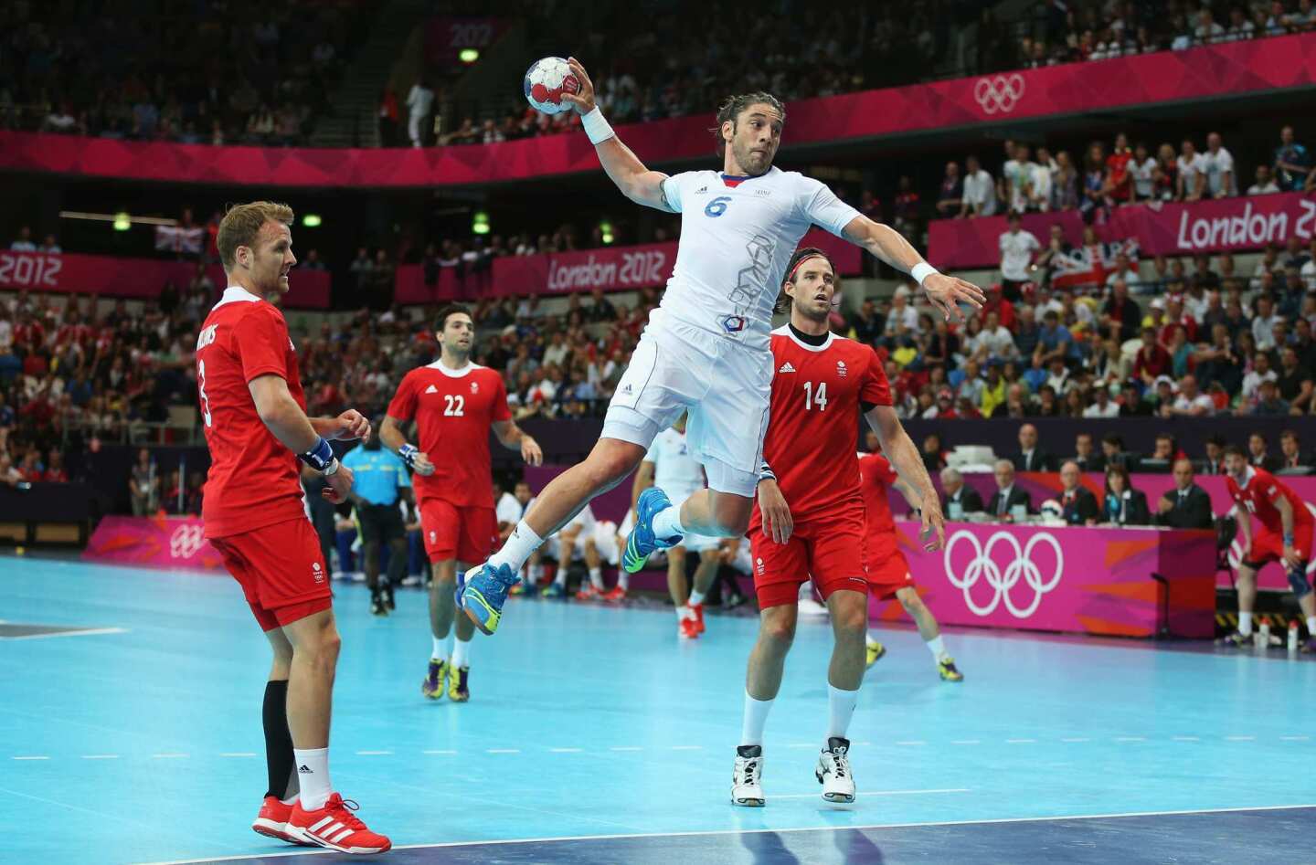 Bertrand Gille of France, one of the world's best players, goes airborne during the men's handball match between France and Great Britain at the Copper Box.