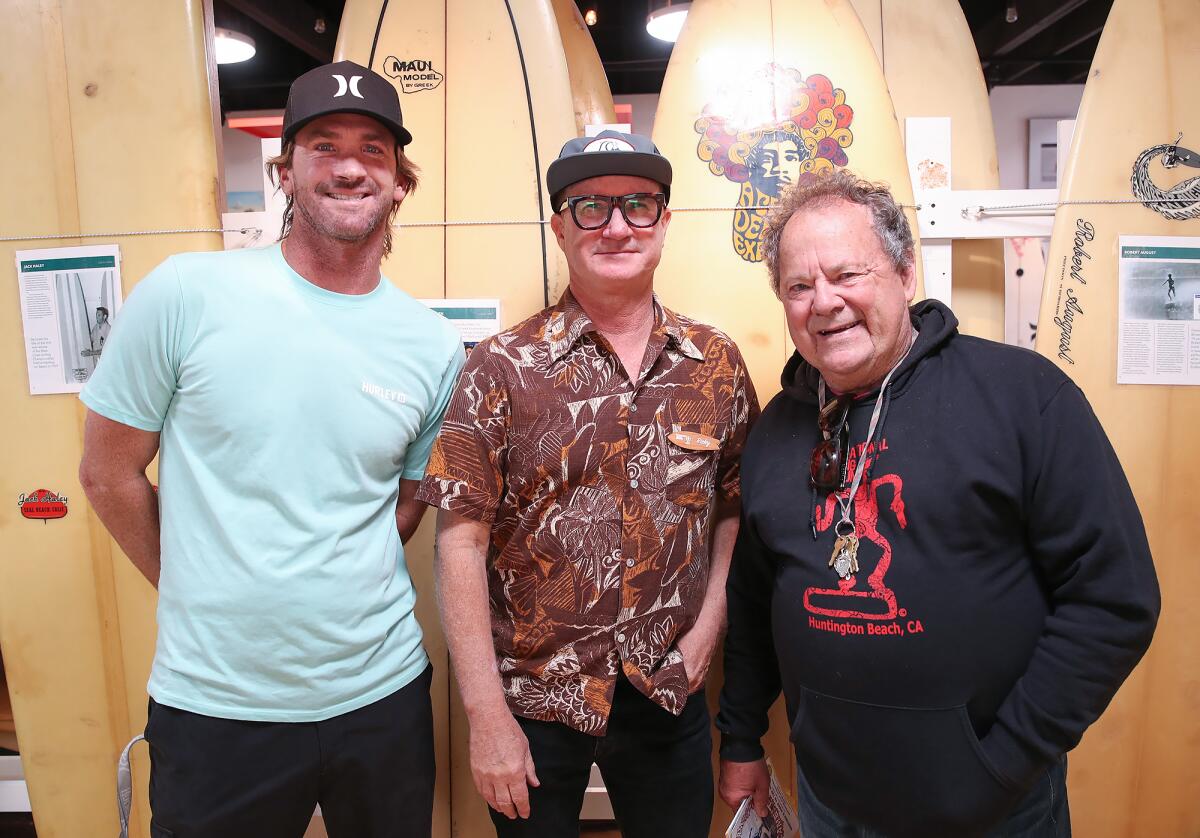 Brett Simpson, Ricky Blake and Peter "PT" Townend officially open the International Surfing Museum's new exhibit on Thursday.