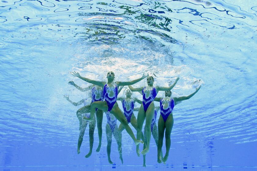 The Egypt artistic swimming team competes during the team free routine final at the 2020 Summer Olympics, Saturday, Aug. 7, 2021, in Tokyo, Japan. (AP Photo/Jeff Roberson)