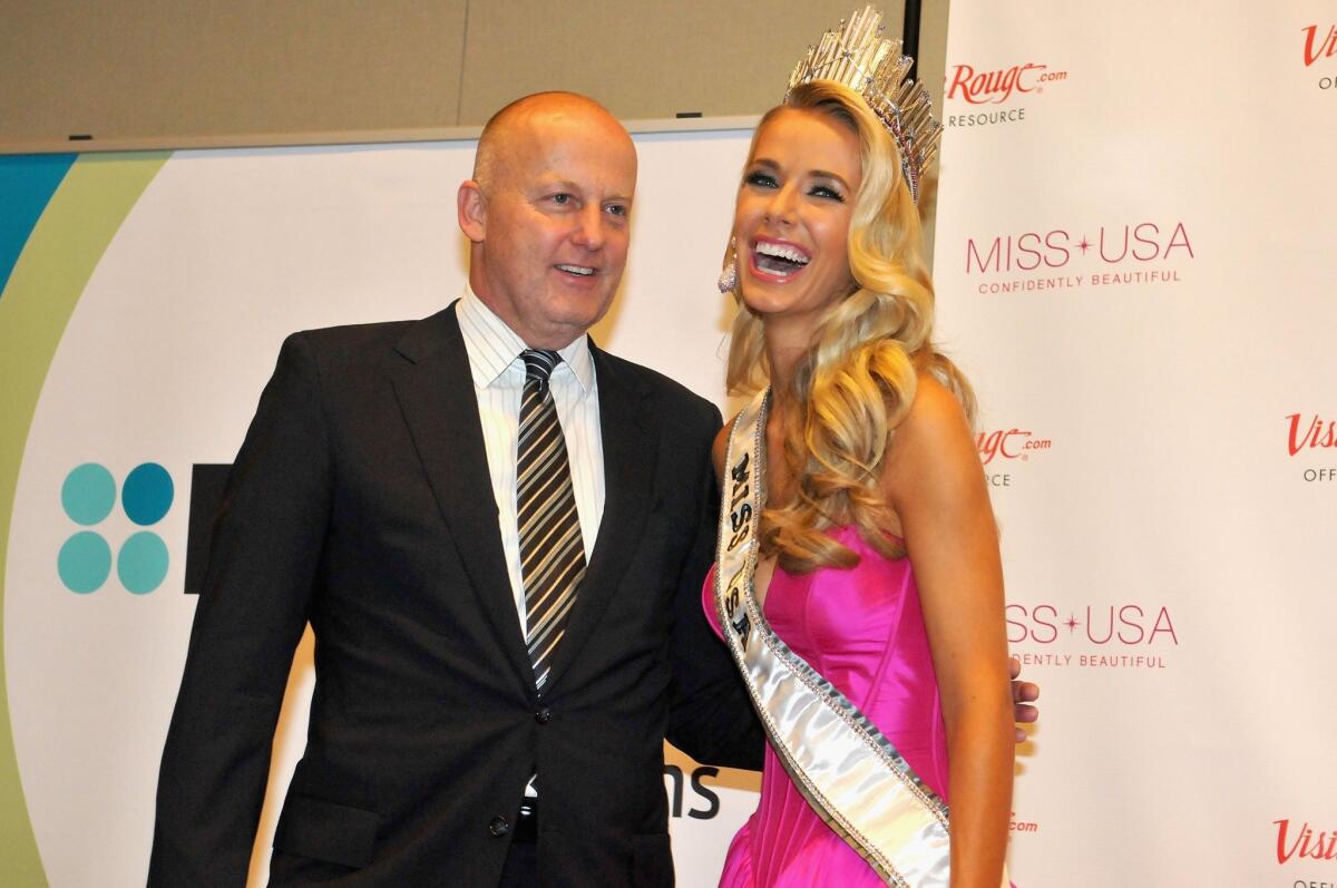 Reelz Chief Executive Stan E. Hubbard poses with Miss USA Olivia Jordan of Oklahoma at the 2015 Miss USA Pageant.