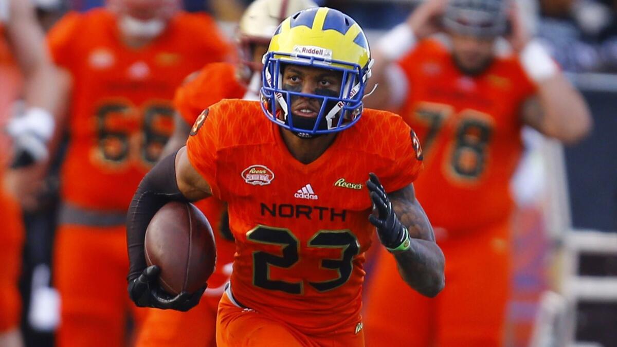 Delaware safety Nasir Adderley carries the ball after intercepting a pass at the Senior Bowl in January.