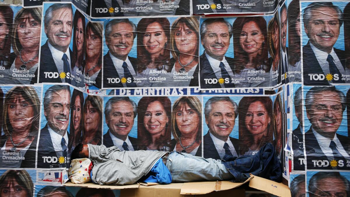 Posters advertise the winning Argentine ticket represented by Alberto Fernandez and Cristina Fernandez in Buenos Aires on Oct. 28, 2019.