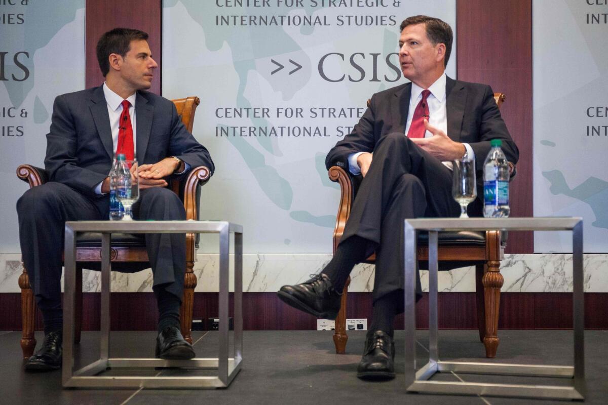 FBI Director James Comey, right, is shown with National Security Division Assistant Atty. Gen. John Carlin during a conference Sept. 14.