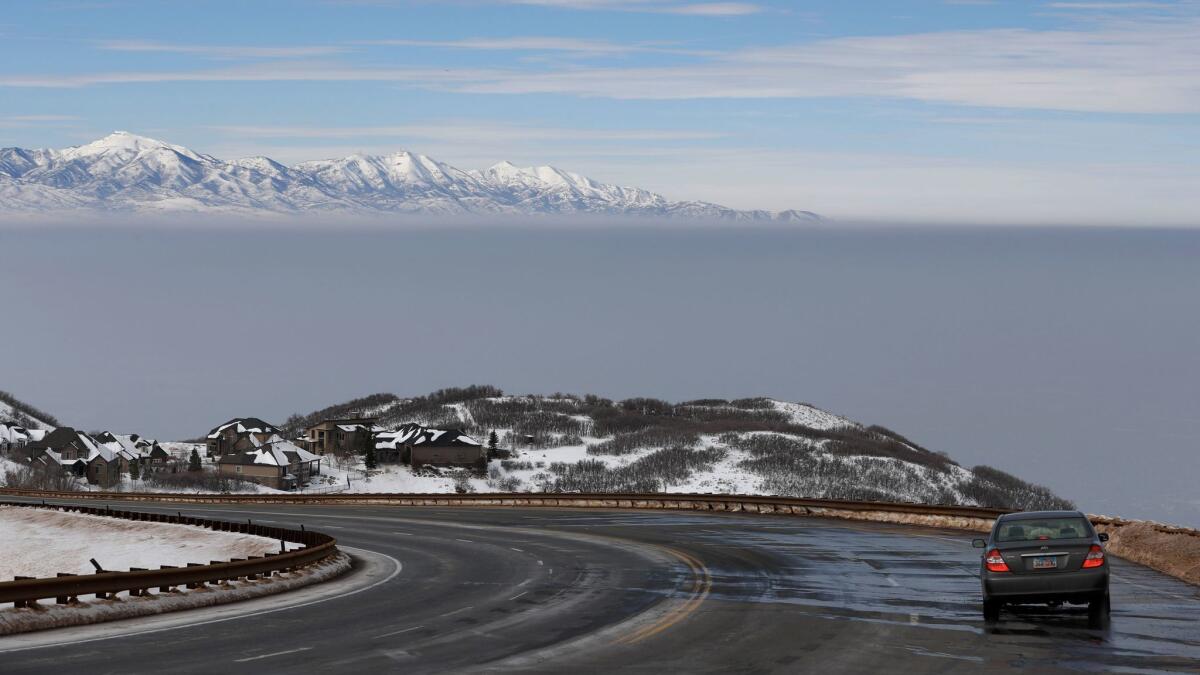 A temperature inversion, seen from Traverse Mountain, traps and fills the Salt Lake Valley with thick smog Tuesday.
