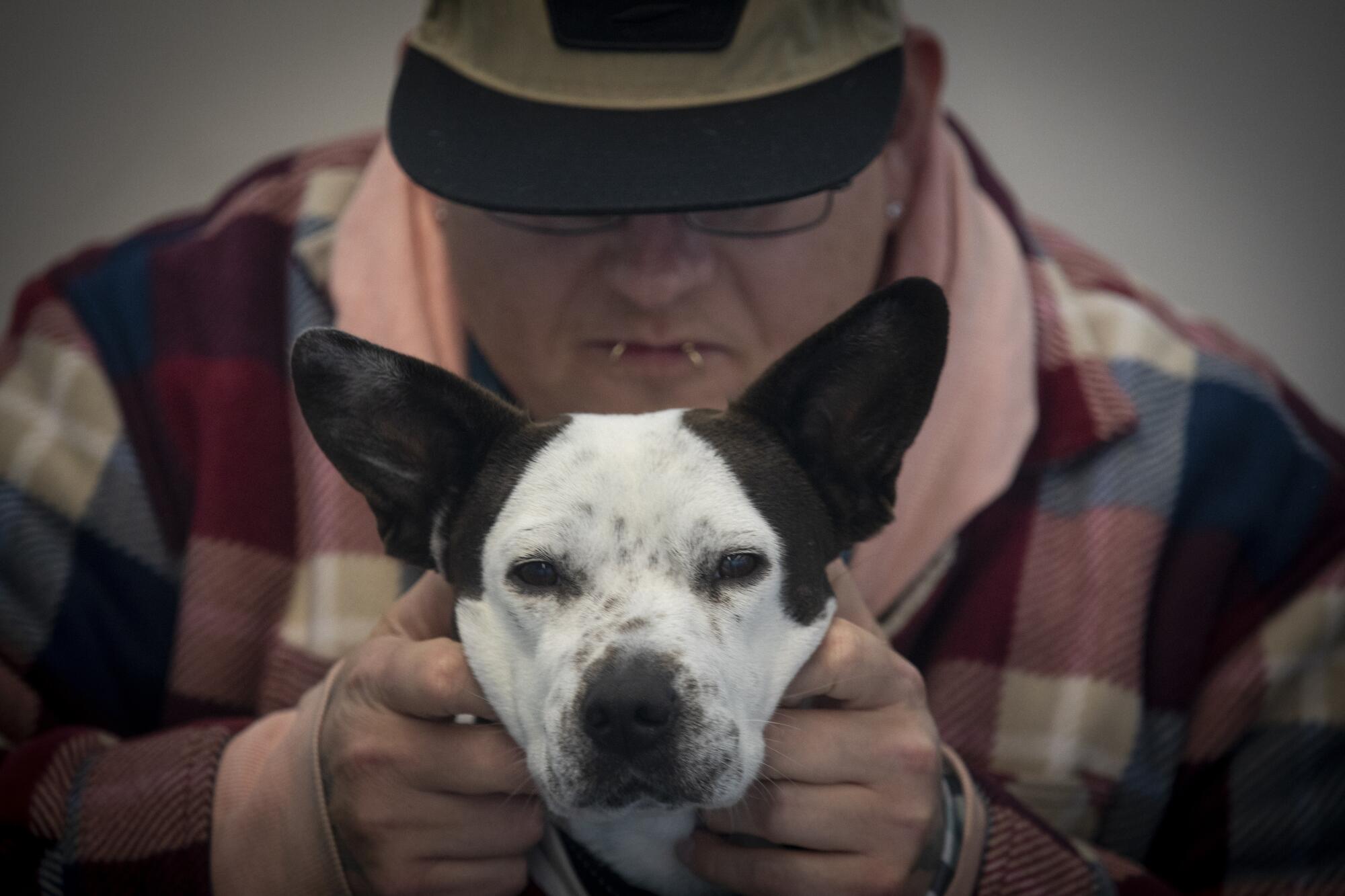 "I have to find a way to pay for her food," Seth Davis said of his support dog, Poppy.