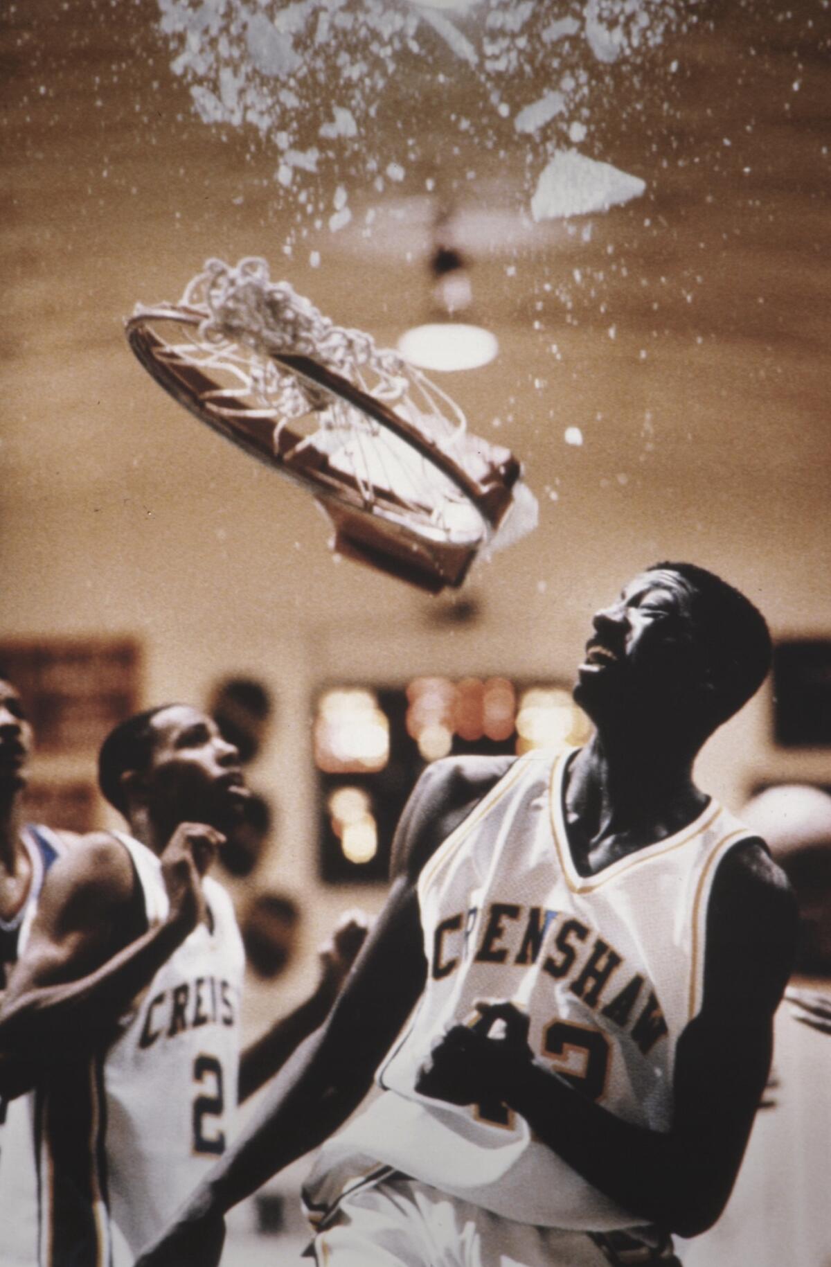 Anne Cusack's 1993 image of Leon Watson shattering the backboard with a 'slam dunk.'  