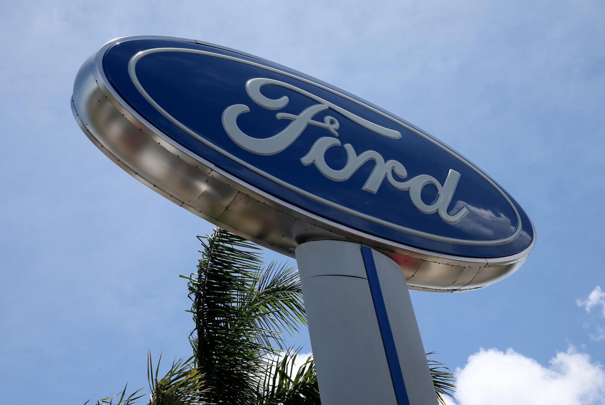 A Ford sign in Miami. The company is the subject of a National Highway Traffic Safety Administration probe into steering defects on some sedans.