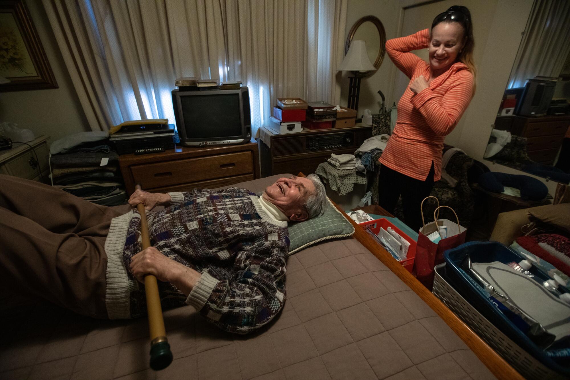 Steve Hideg, 91, left, is doing his physical therapy at home