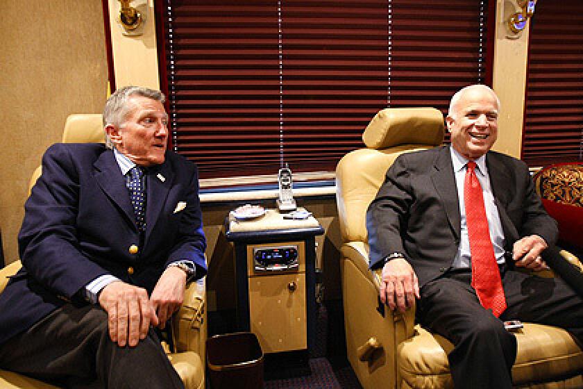 Republican presidential candidate, Sen. John McCain, right, and former Navy Secretary John Lehman speak on McCain's campaign bus, Friday, March 14, 2008, after a town hall meeting in Springfield, Pa.