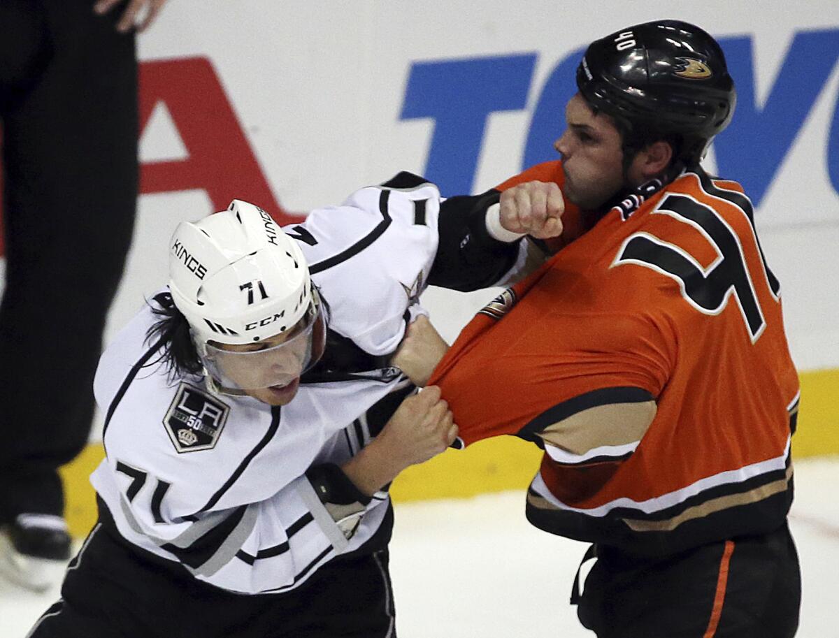 Kings center Jordan Nolan (71) and Ducks right winger Jared Boll (40) fight in the first period on Nov. 20.