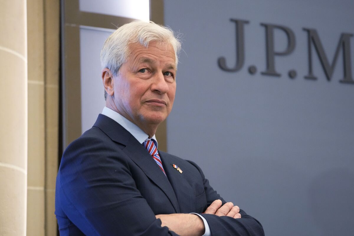 FILE - JP Morgan CEO Jamie Dimon looks on during the inauguration the new French headquarters of JP Morgan bank, June 29, 2021 in Paris. Dimon laid out a laundry list of big risks looming for the global and U.S. economy in his annual letter to JPMorgan Chase shareholders on Monday, April 4, 2022. (AP Photo/Michel Euler, Pool, File)