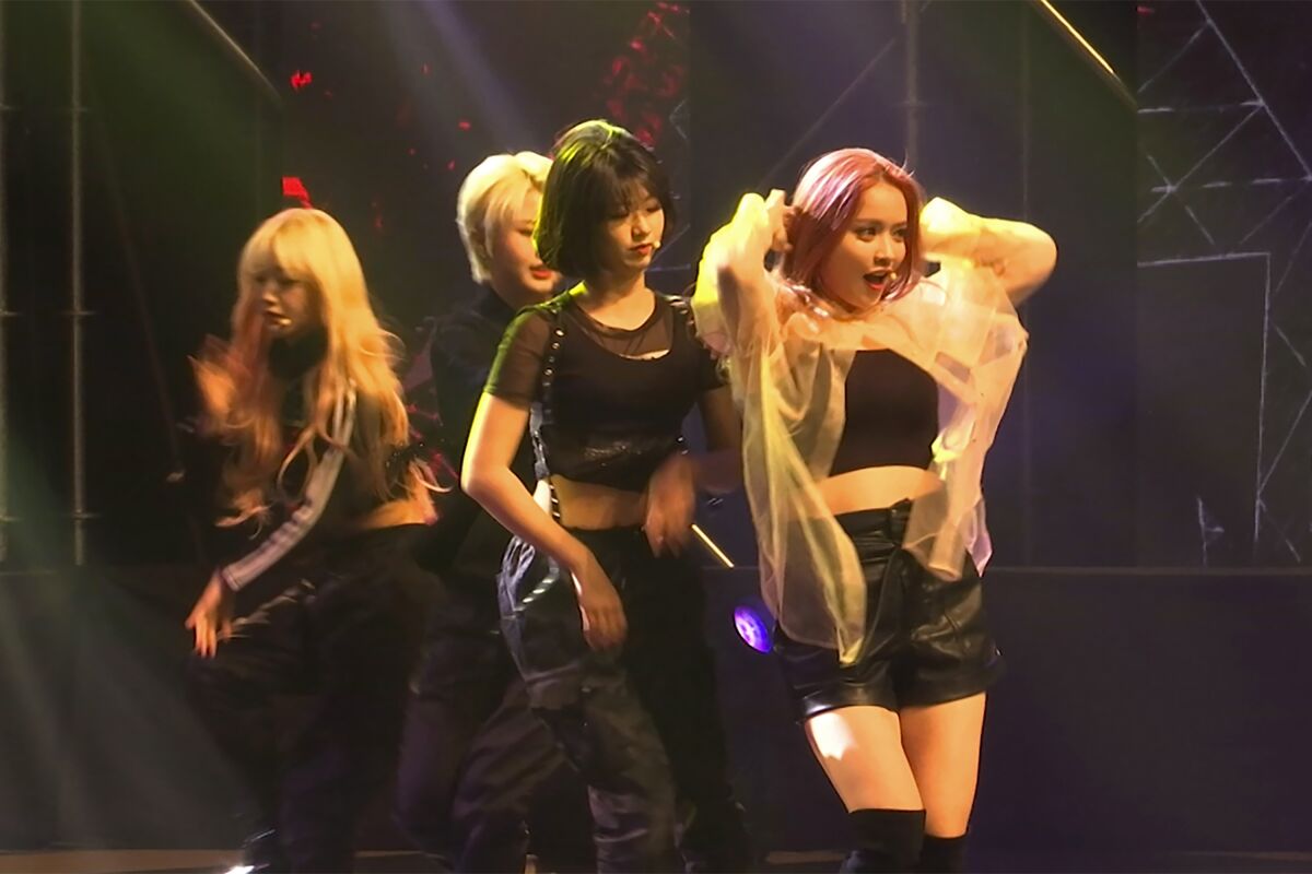In this image made from a video, former and current members of K-pop band "Girls Alert" perform for end-of-year concert at Nowon district residential center in Seoul on Nov. 22, 2019. While popular K-pop bands like BTS and Blackpink have gone from strength to strength during the coronavirus pandemic, lesser-known acts are struggling. (AP Photo/Park Juwon)