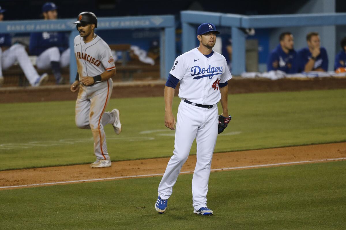 Dodgers reliever Blake Treinen reacts after giving up a three-run home run to Buster Posey.