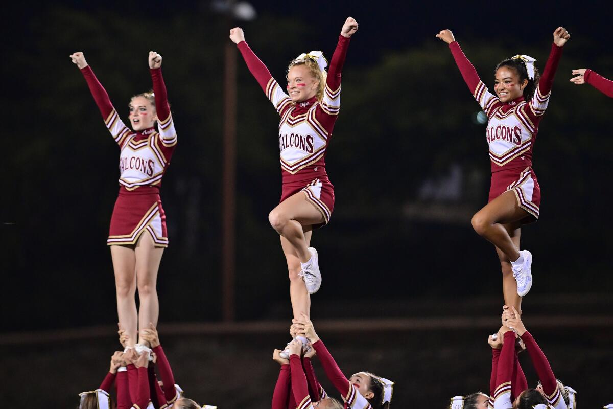 The Torrey Pines cheer squad standing tall.