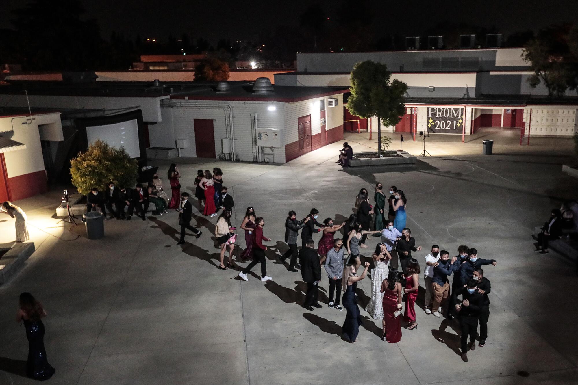  With a few minutes left before the 11pm cutoff time, a hand full of students continue to dance at prom.