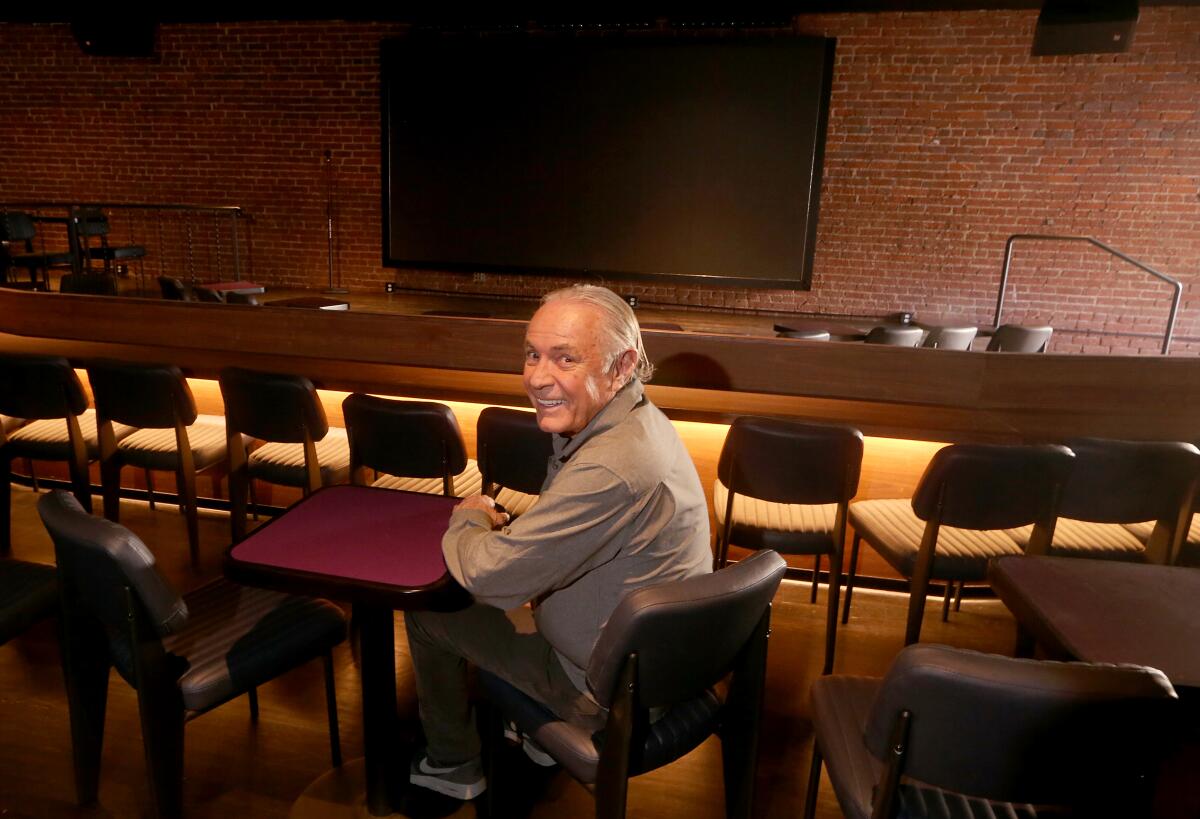 Johnny Buss, the son of late Lakers owner Jerry Buss, sits in the Ice House comedy club in February 2023.