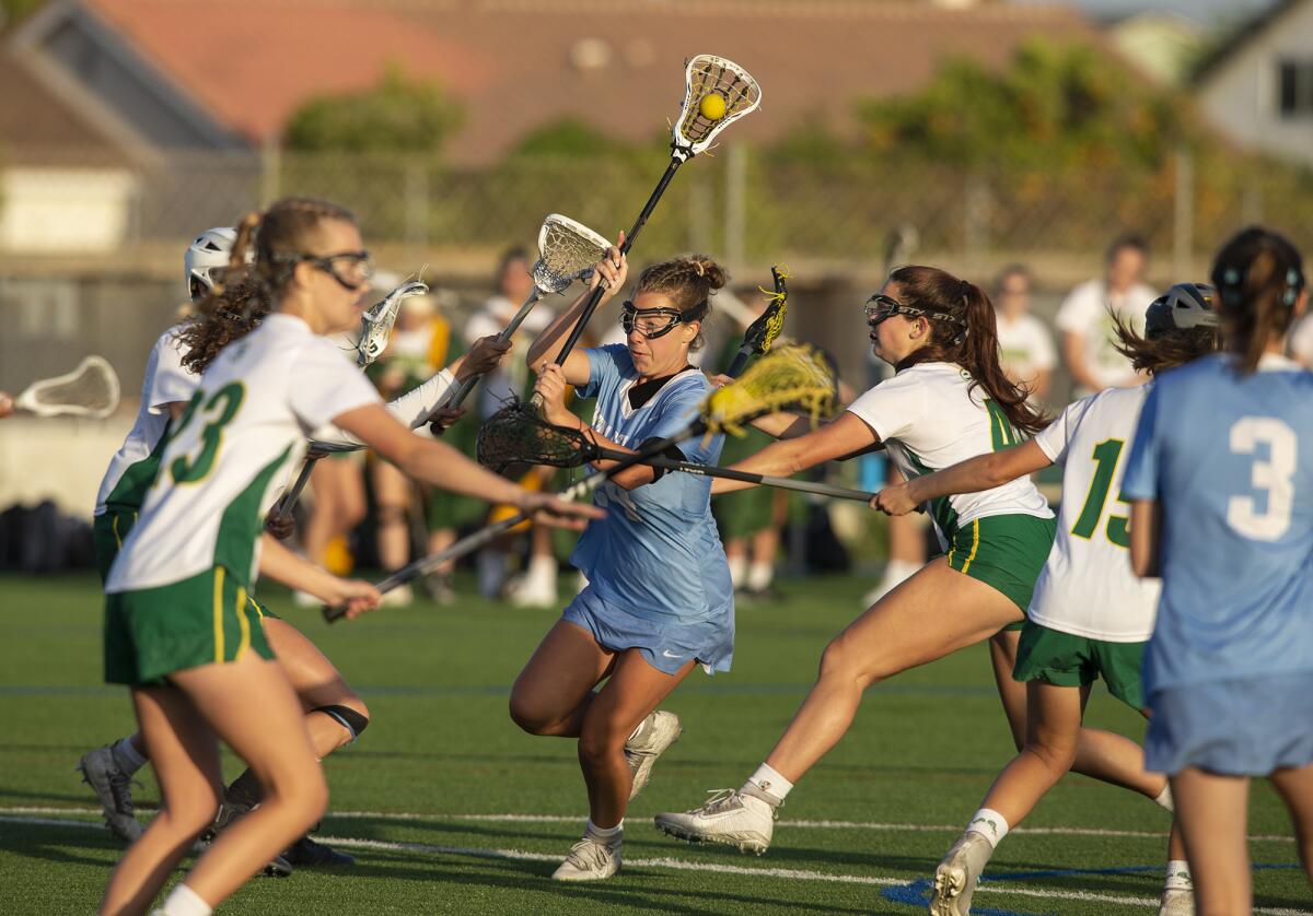 Corona del Mar's Belle Grace splits traffic to take a shot during a Sunset League match against Edison on Tuesday.