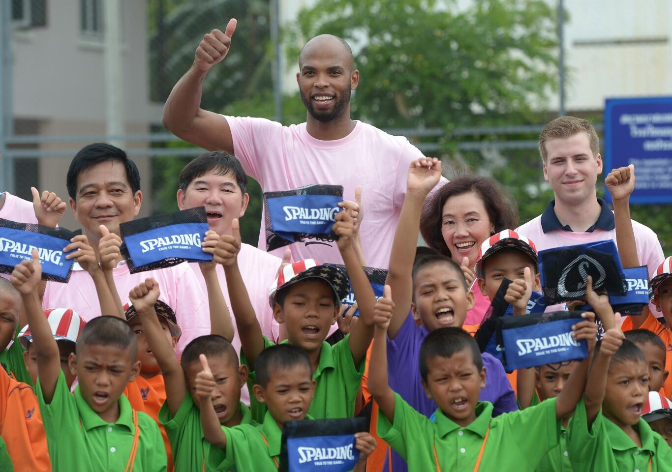 Taj Gibson poses at a training session with Thai boys at Reception Home for Boys in a suburb of Bangkok.