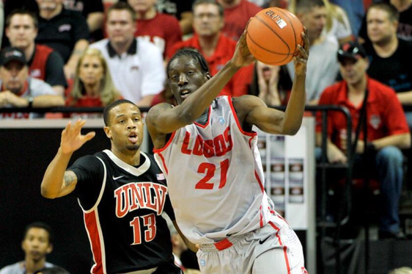 New Mexico guard Tony Snell receives a pass as he cuts to the basket against UNLV's Bryce DeJean-Jones in the championship game of the Mountain West Conference tournament.