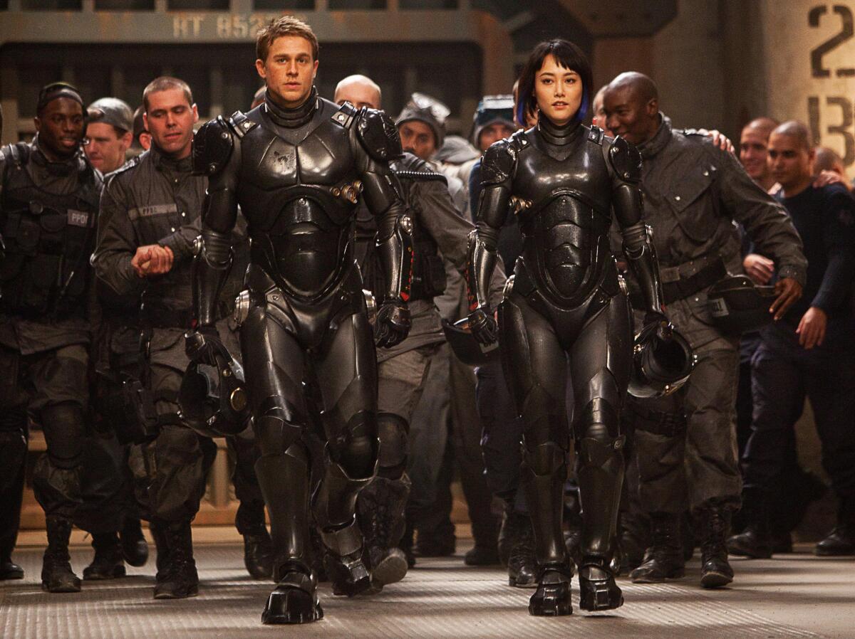 Charlie Hunnam as Raleigh Becket and Rinko Kikuchi as Mako Mori in the sci-fi action adventure "Pacific Rim" from Warner Bros. Pictures and Legendary Pictures.