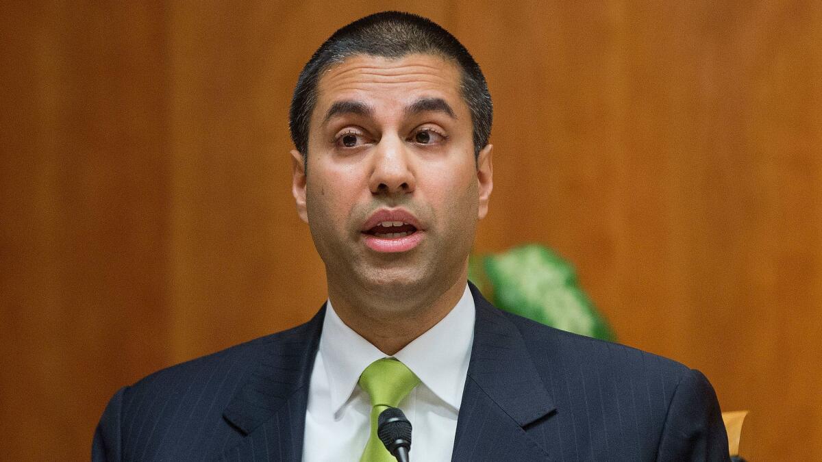 Federal Communication Commission Chairman Ajit Pai, shown in 2015, wants to eliminate rules that bar a company from owning both newspapers and TV stations in one market.