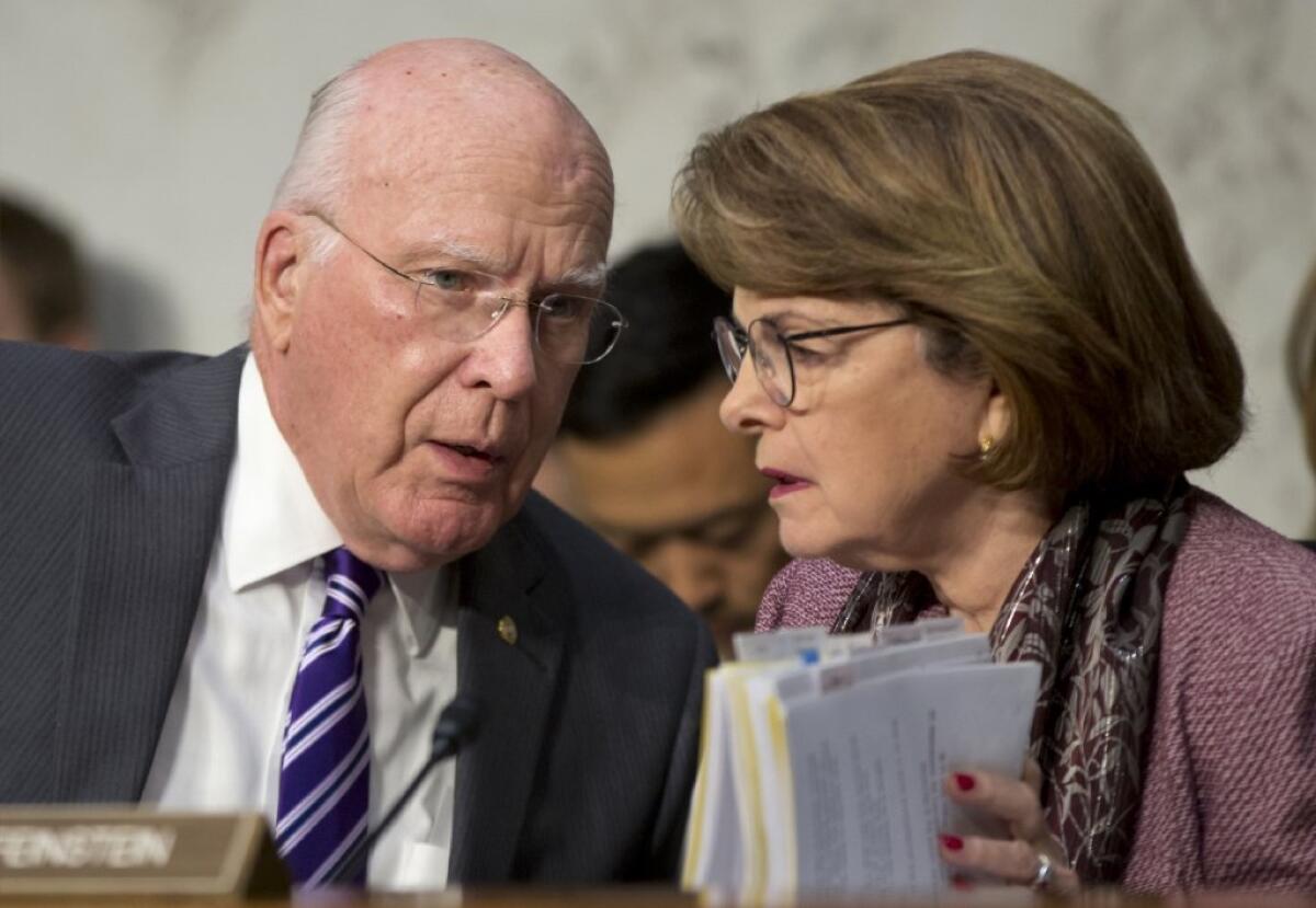 The Senate Judiciary Committee has approved a bill that would provide protection for journalists who promise confidentiality to their sources. Above, Senate Judiciary Committee Chairman Patrick Leahy (D-Vt.) speaks with Sen. Dianne Feinstein (D-Calif.) at a committee meeting in July.