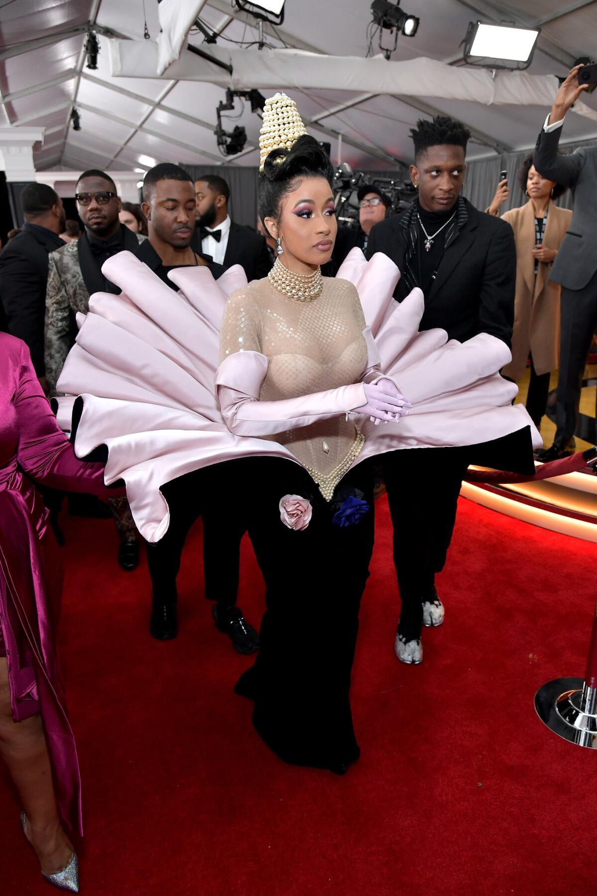 Cardi B in Mugler haute couture, center, with her stylist Kollin Carter, right, at the 61st Grammy Awards at Staples Center in downtown Los Angeles on Sunday.