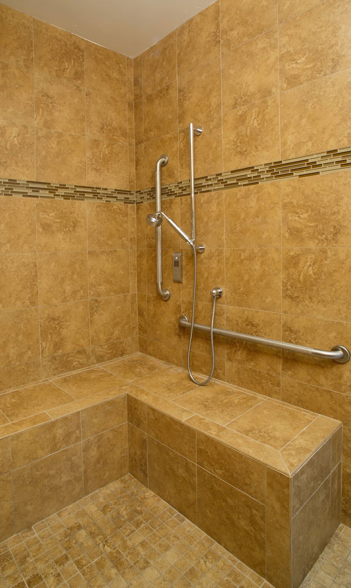 The master shower has a zero-threshold entry and a broad built-in bench. — Nelvin C. Cepeda