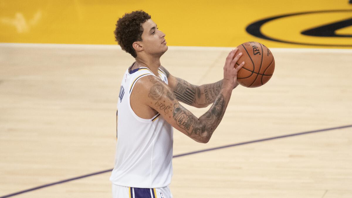Lakers forward Kyle Kuzma shoots during an NBA preseason game against the Clippers.
