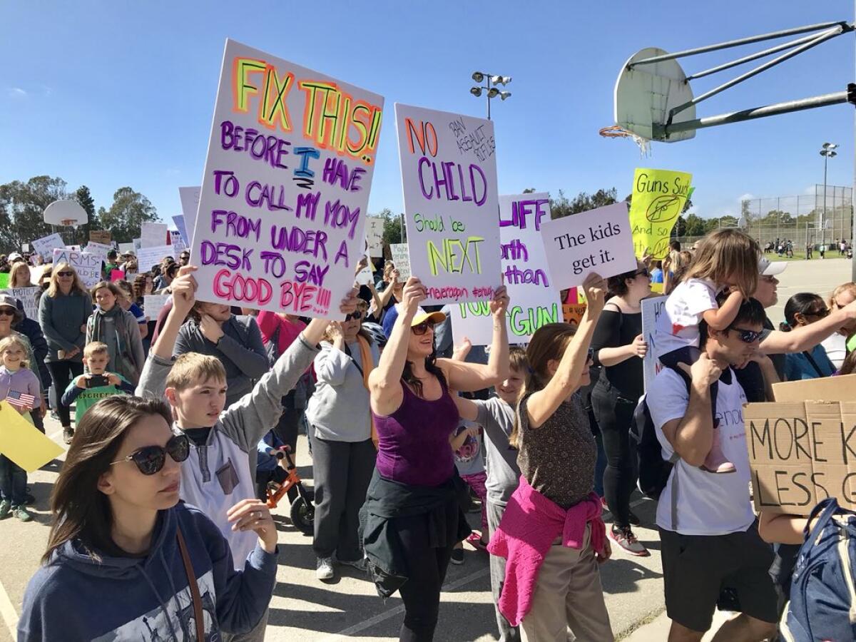 Marchers gather at Centennial Regional Park in Santa Ana for the March for Our Lives event.