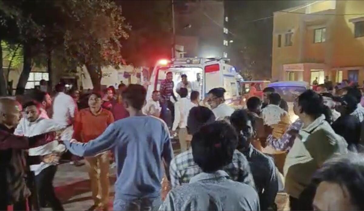 A crowded scene outside a hospital.