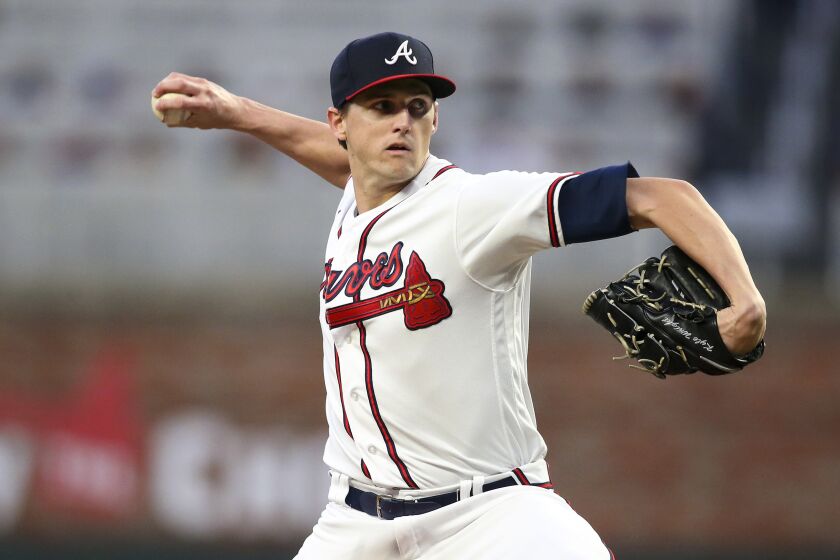 Atlanta Braves starting pitcher Kyle Wright throws during the first inning of the team's baseball game against the New York Mets, Saturday, Oct. 1, 2022, in Atlanta. (AP Photo/Brett Davis)