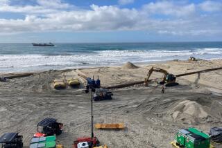 A U.S. Army Corps of Engineers sand replenishment project underway Tuesday at Fletcher Cove in Solana Beach.