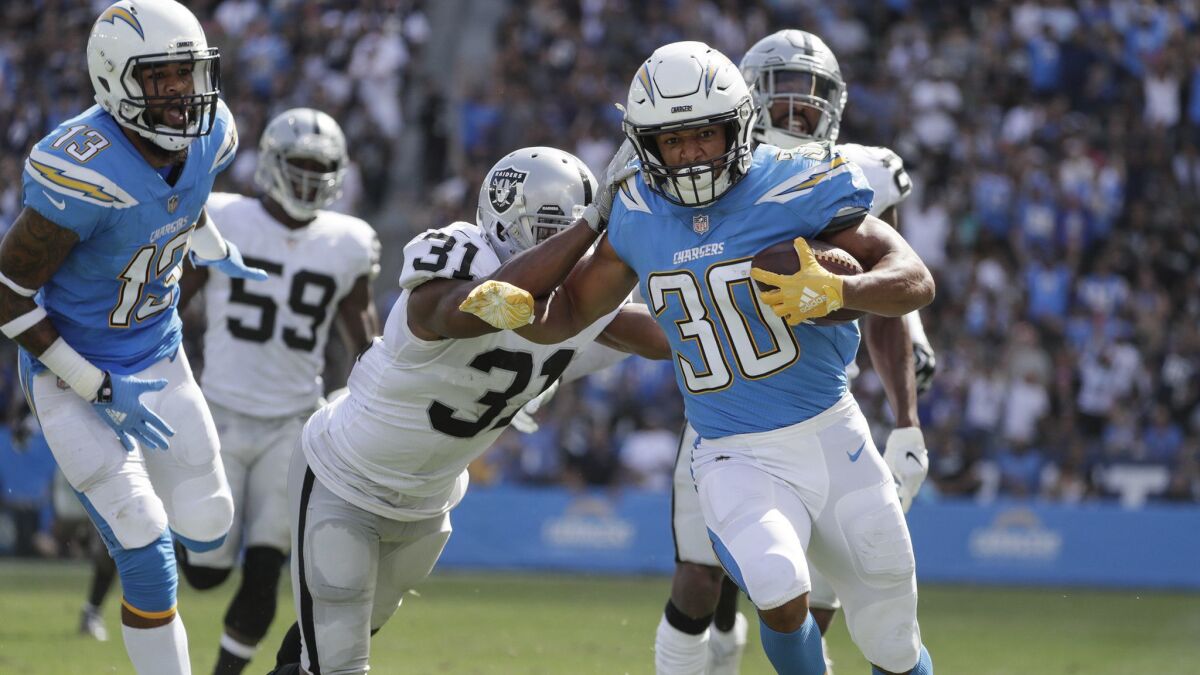 Chargers running back Austin Ekeler outruns the Raiders defense for a 44-yard touchdown on a screen pass from Philip Rivers at StubHub Center.