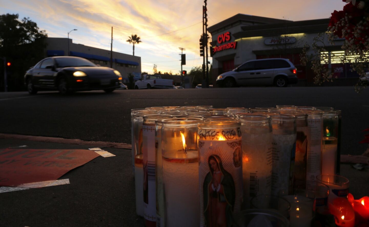 A memorial of candles marks the spot where Andres Perez, 17, of Montebello was struck and killed by a city truck as crossed the street near his school at the corner of Avenue 60 and Figueroa Street in Highland Park.